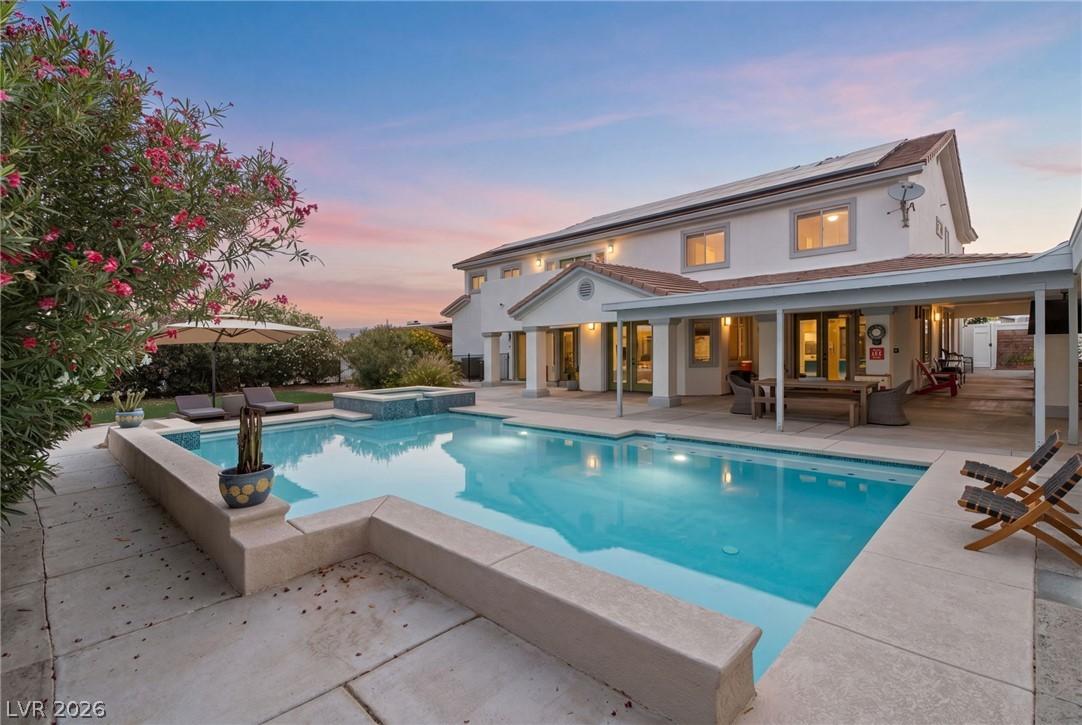 Image 4: An inviting private pool and spa define this expan