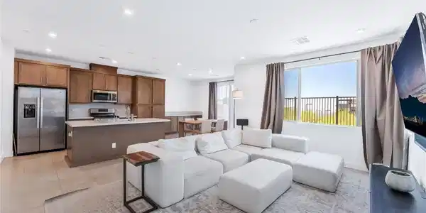 Image 2: An open concept living area seamlessly blends a co