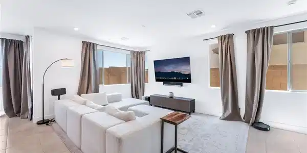 Image 3: A well-lit gathering space offers relaxation, with