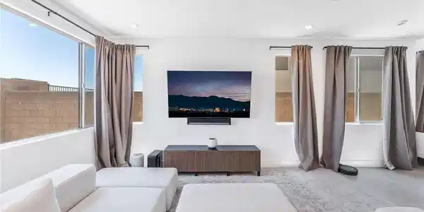 Image 4: An inviting family room with plush seating and swe