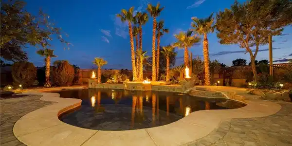 Image 2: An inviting backyard oasis showcases a resort-styl