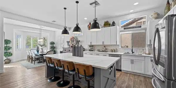 Image 4: Natural light floods this dining area, highlightin