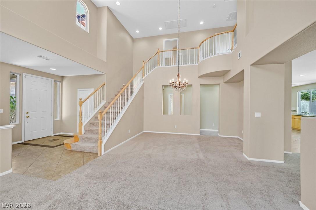 Image 3: Grand two-story foyer and staircase create a state