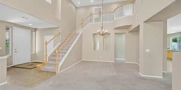 Image 3: Grand two-story foyer and staircase create a state