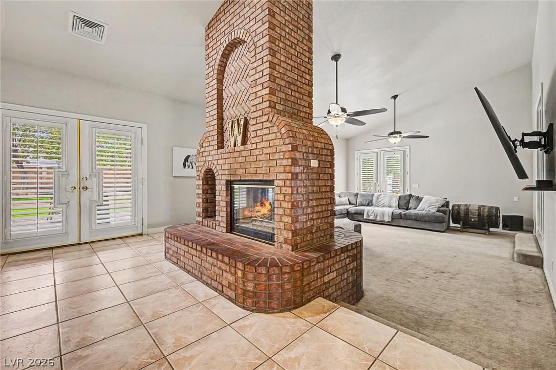 Image 4: A spacious living area showcasing a dramatic brick