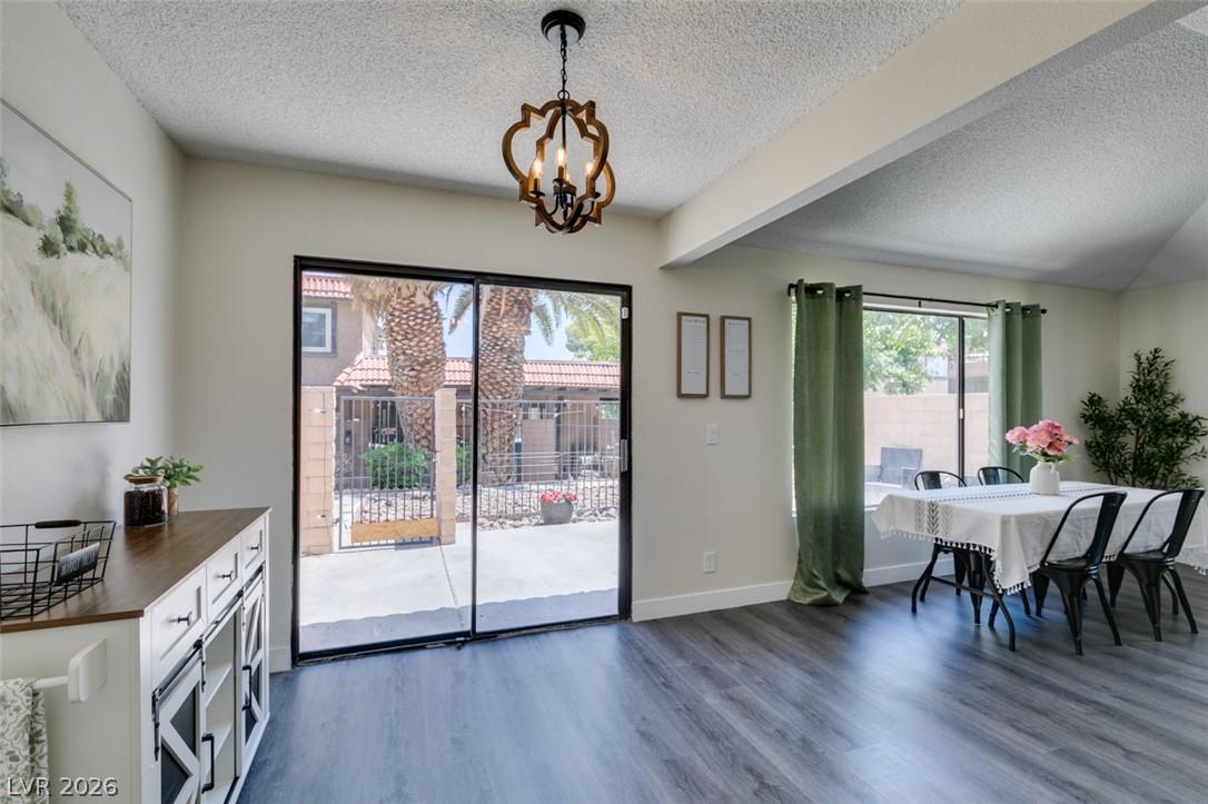 Image 2: A well-lit dining area offers direct access to a p