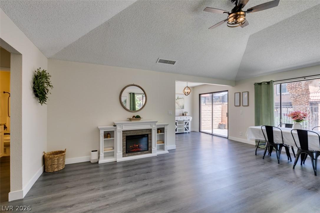 Image 3: A welcoming living space features a cozy fireplace