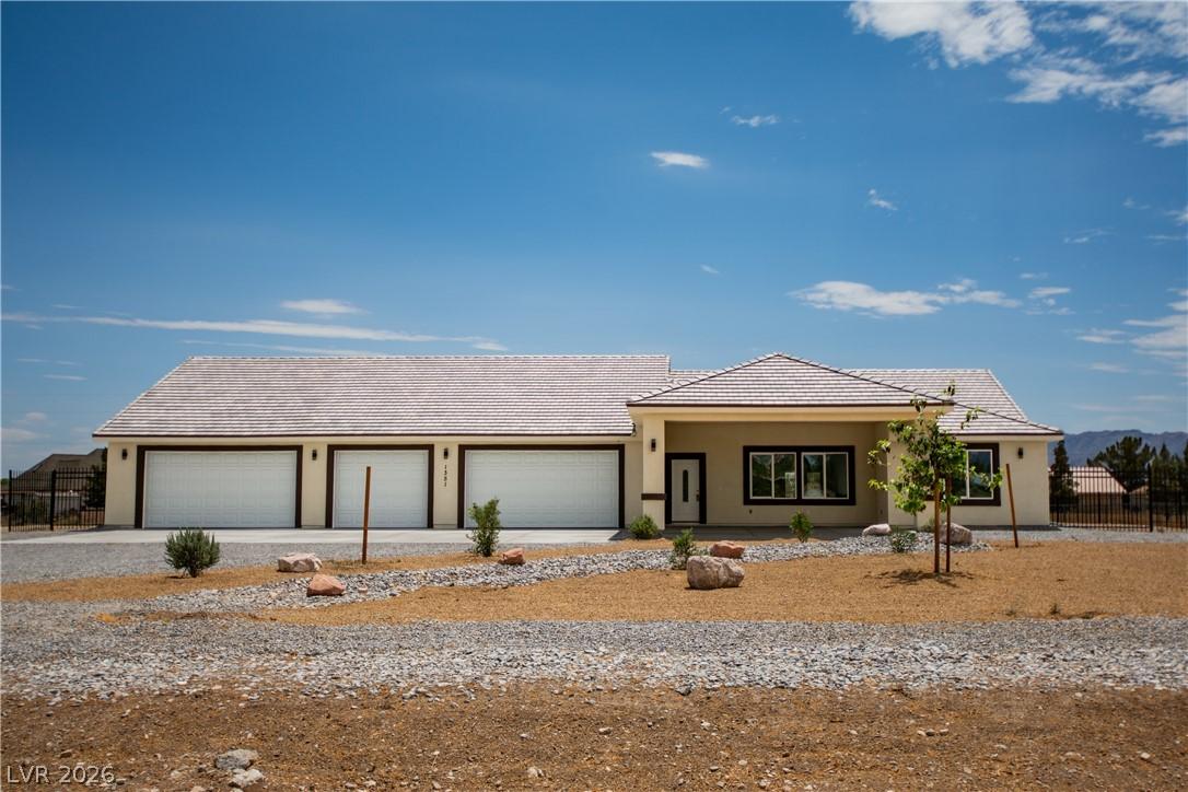 Image 1: A desert-friendly landscape surrounds this cream-c