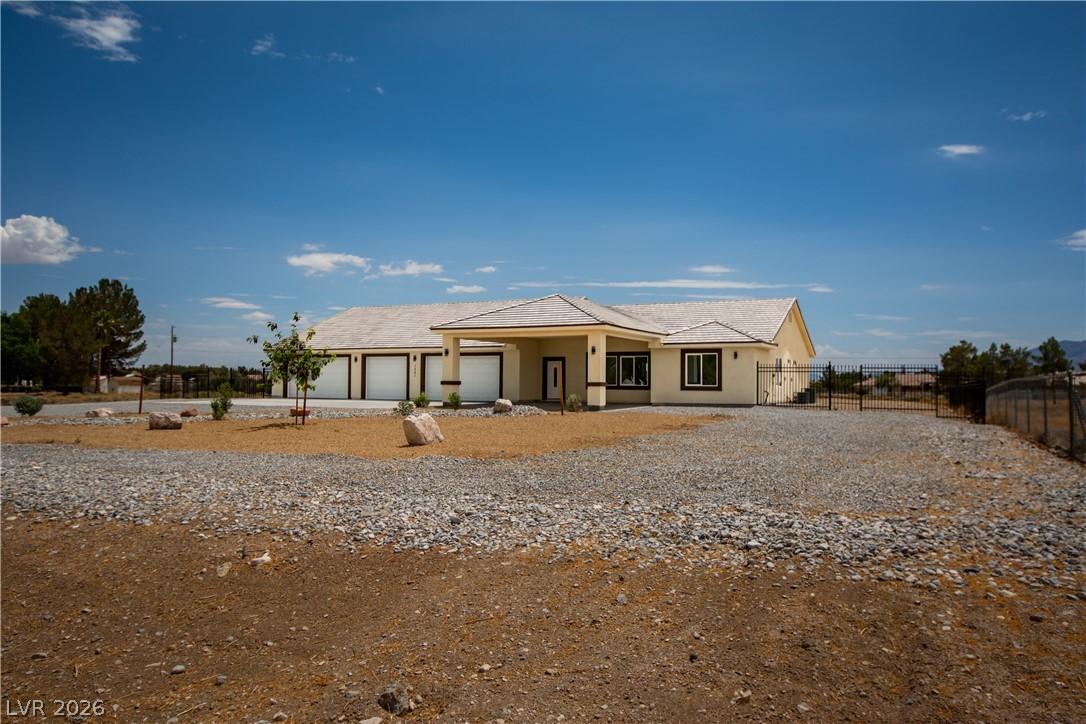 Image 2: A spacious home with an attached multi-car garage