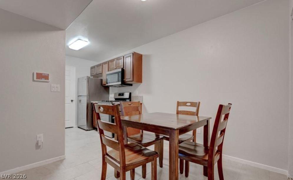 Image 4: A compact kitchen with sleek appliances and practi