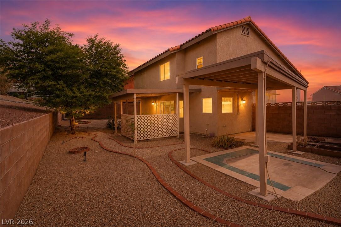 Image 4: A private backyard oasis with ample space for rela
