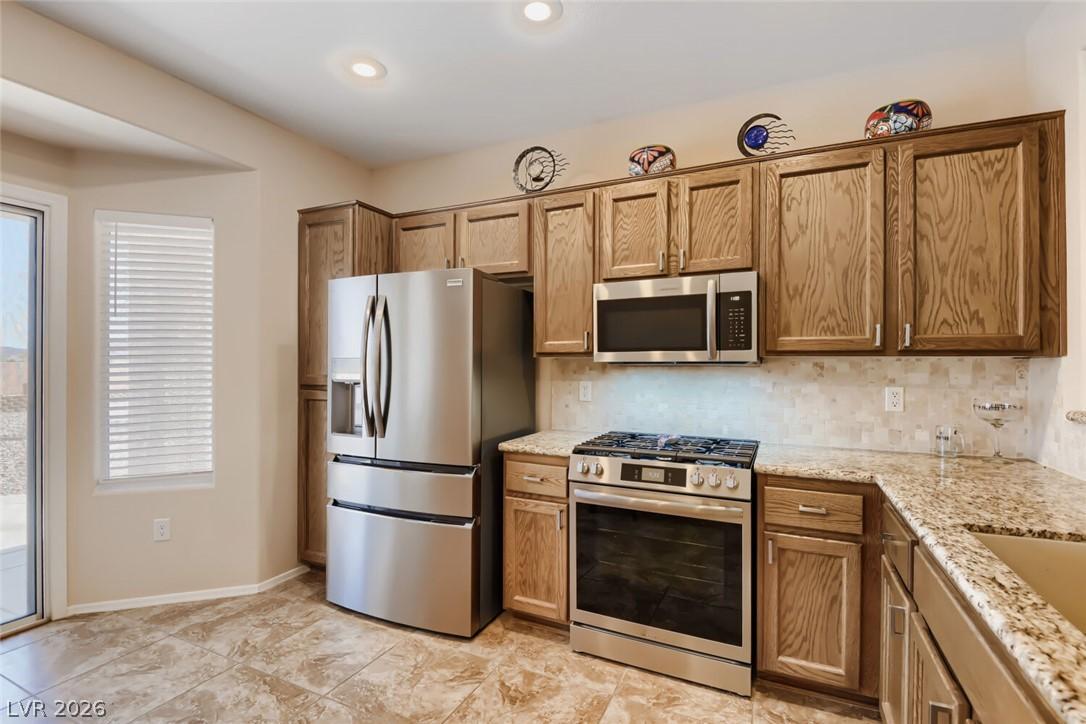 Image 4: A functional culinary space boasts ample cabinet s