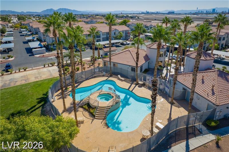Image 2: An aerial perspective reveals a sparkling pool and