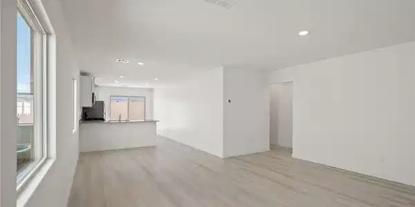 Image 2: Clean lines and light wood flooring define this op