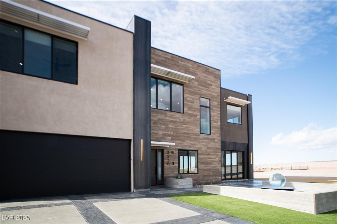 Image 3: View of building exterior with a garage