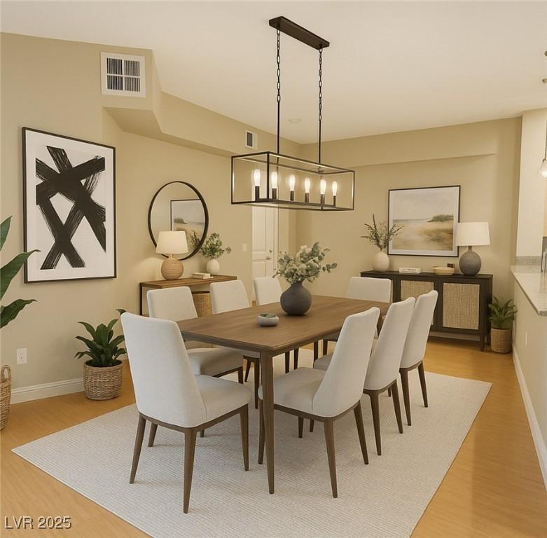 Image 4: Dining area featuring light wood finished floors