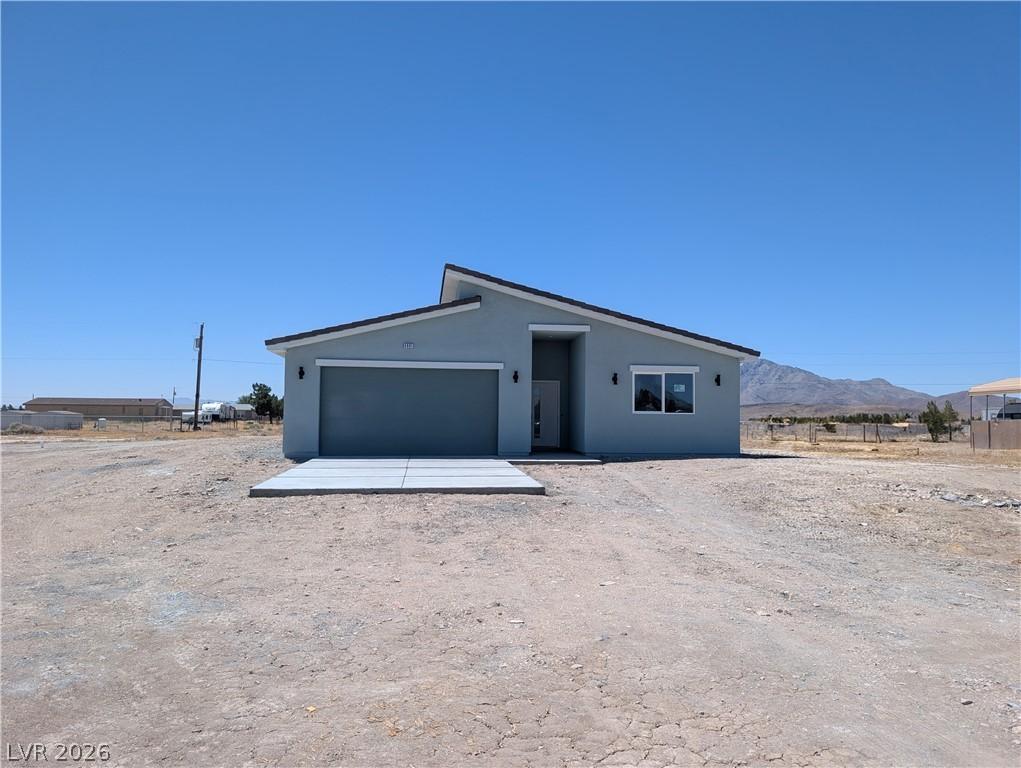 Image 1: Modern desert dwelling with an attached garage, of