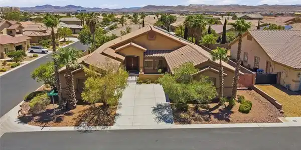 Image 3: A terracotta-roofed residence nestled amidst deser