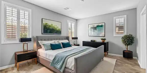 Image 2: Relax in this well-appointed bedroom featuring att