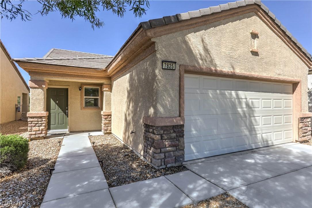 Image 4: This inviting home features a covered entryway, a