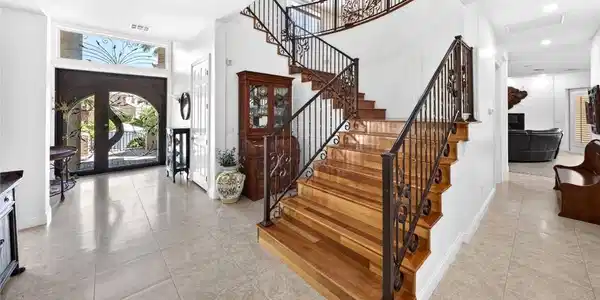 Image 4: Ornate wrought iron banisters guide the eye up a g
