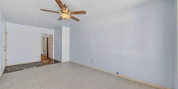 Image 2: A versatile living area features tiled flooring, l