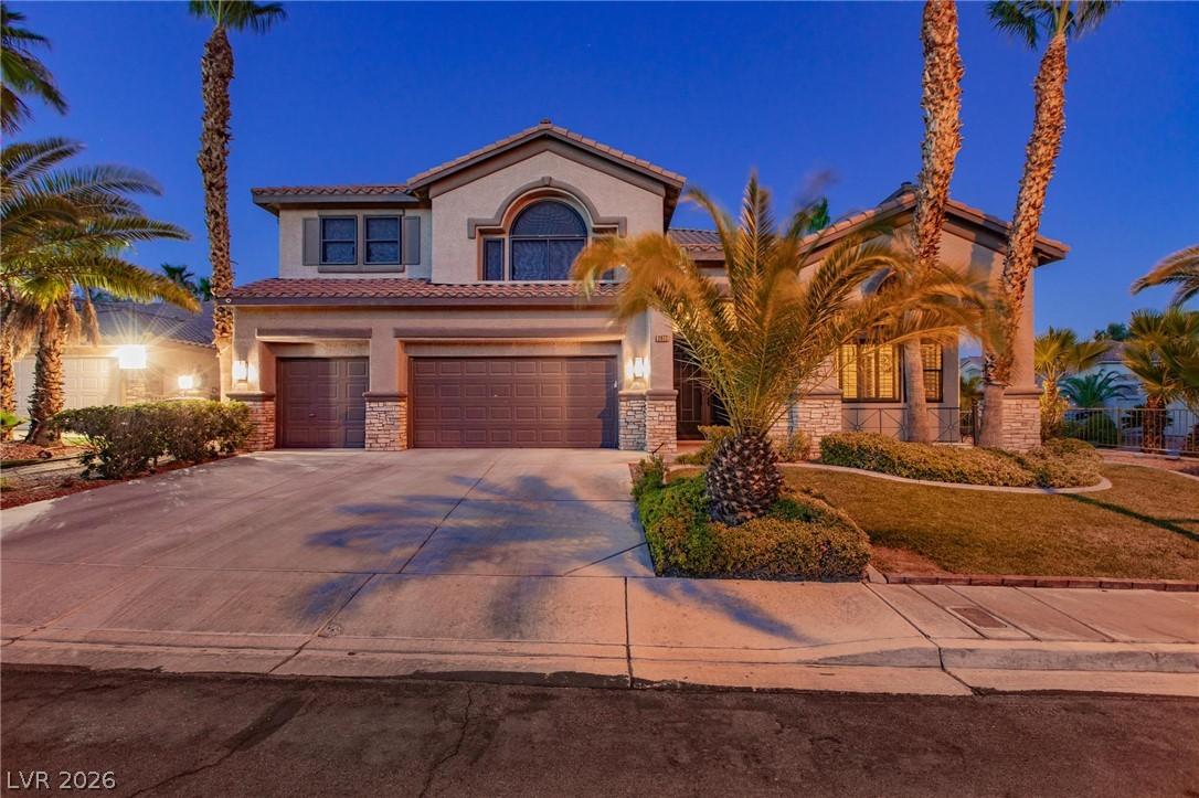 Image 3: A graceful home with mature palms and tidy landsca