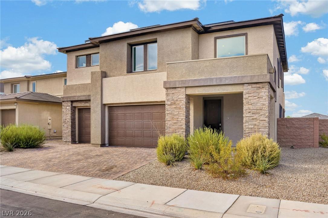 Image 2: A modern facade with stacked stone accents and an