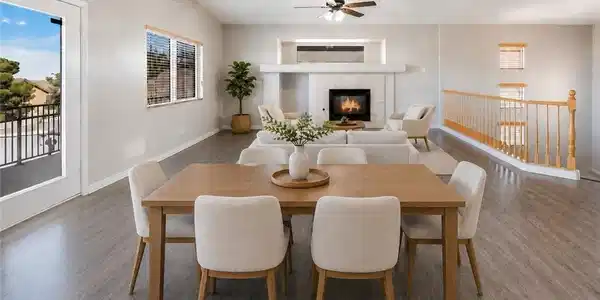 Image 4: An inviting open-concept space features a dining a
