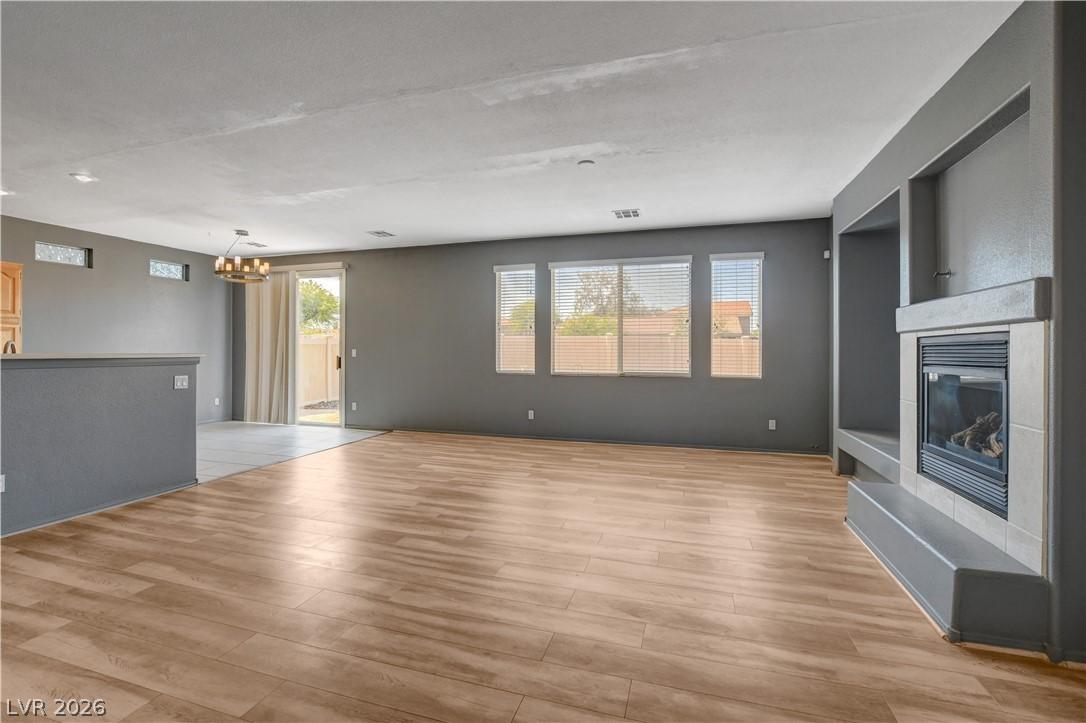 Image 2: A welcoming living area boasts durable laminate fl