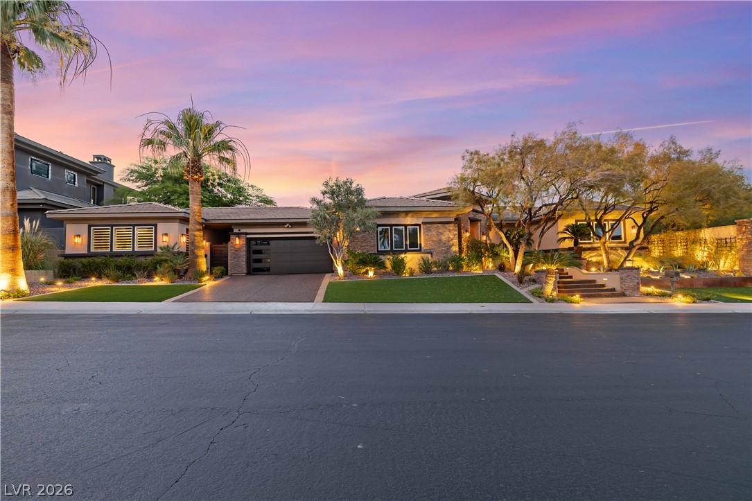 Image 1: Illuminated by evening lights, this residence show