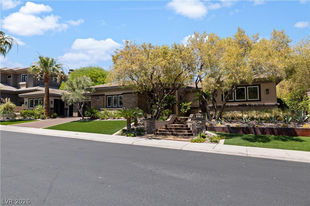 Image 2: Mature trees and desert-friendly landscaping adorn