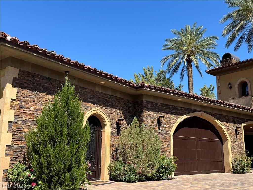 Image 4: Stone veneer adorns the exterior, complemented by
