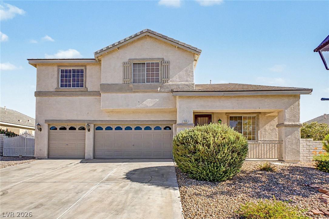 Image 2: A cream-colored stucco home presents a welcoming f