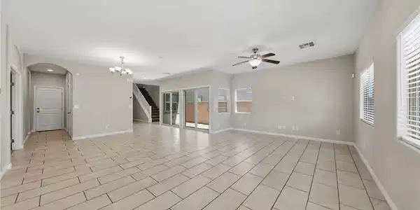 Image 3: Gleaming tile floors stretch across a spacious, op