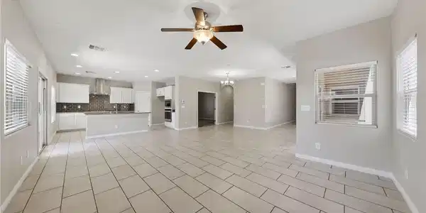 Image 4: An open floorplan seamlessly connects the airy liv