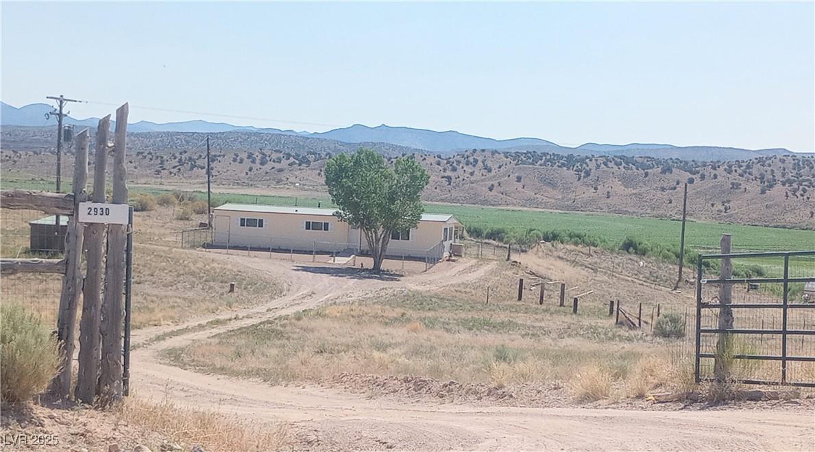 Image 1: Mountain view with rural landscape
