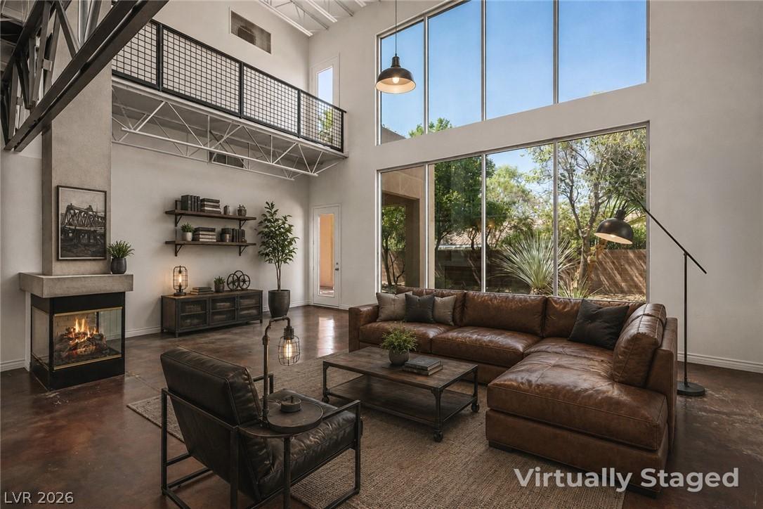 Image 1: An inviting great room with expansive 30 foot floo