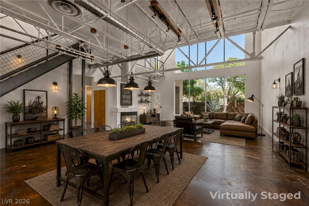 Image 2: This expansive space showcases high ceilings and a