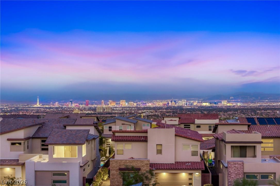 Image 2: City lights twinkle across the horizon, complement
