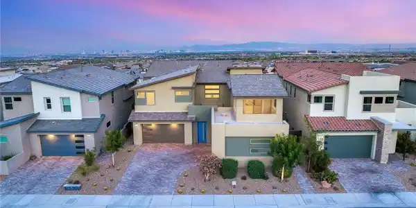Image 4: Showcasing contemporary architecture, this home bo