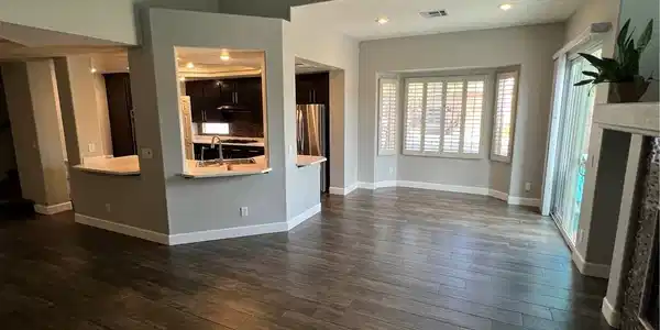 Image 4: Rich wood-look flooring and plantation shutters br