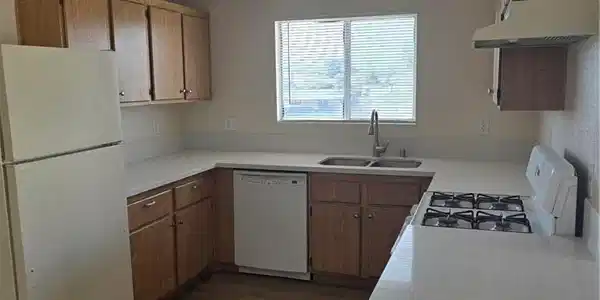 Image 2: Kitchen featuring range, dark wood finished floors