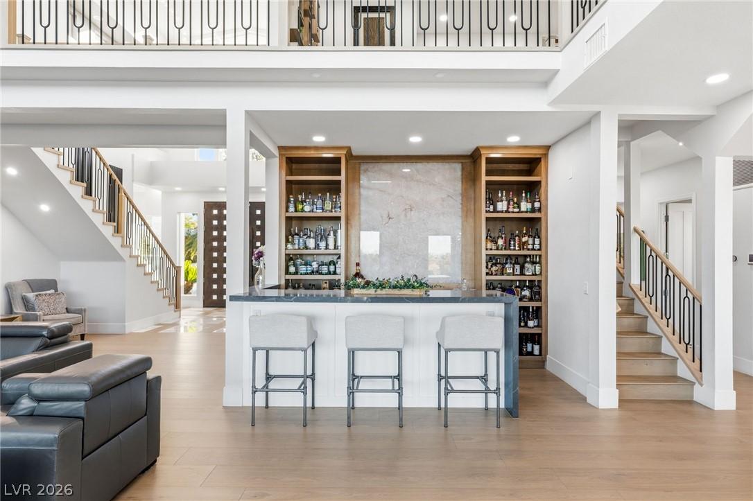 Image 4: This bright and open-concept home features a sophi