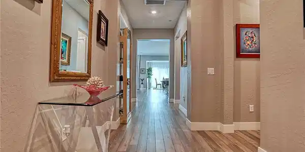 Image 3: A well-lit corridor with recessed lighting guides