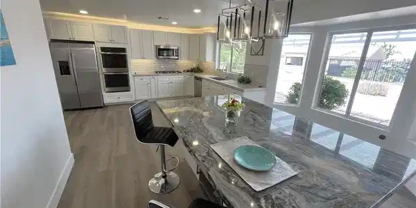 Image 2: Dining Island with Wine Fridge opens to Living Roo