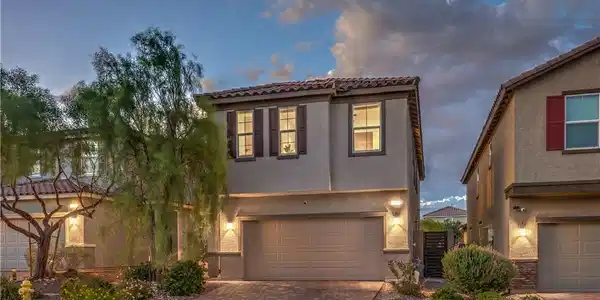 Image 2: An inviting exterior displays stone-paved driveway