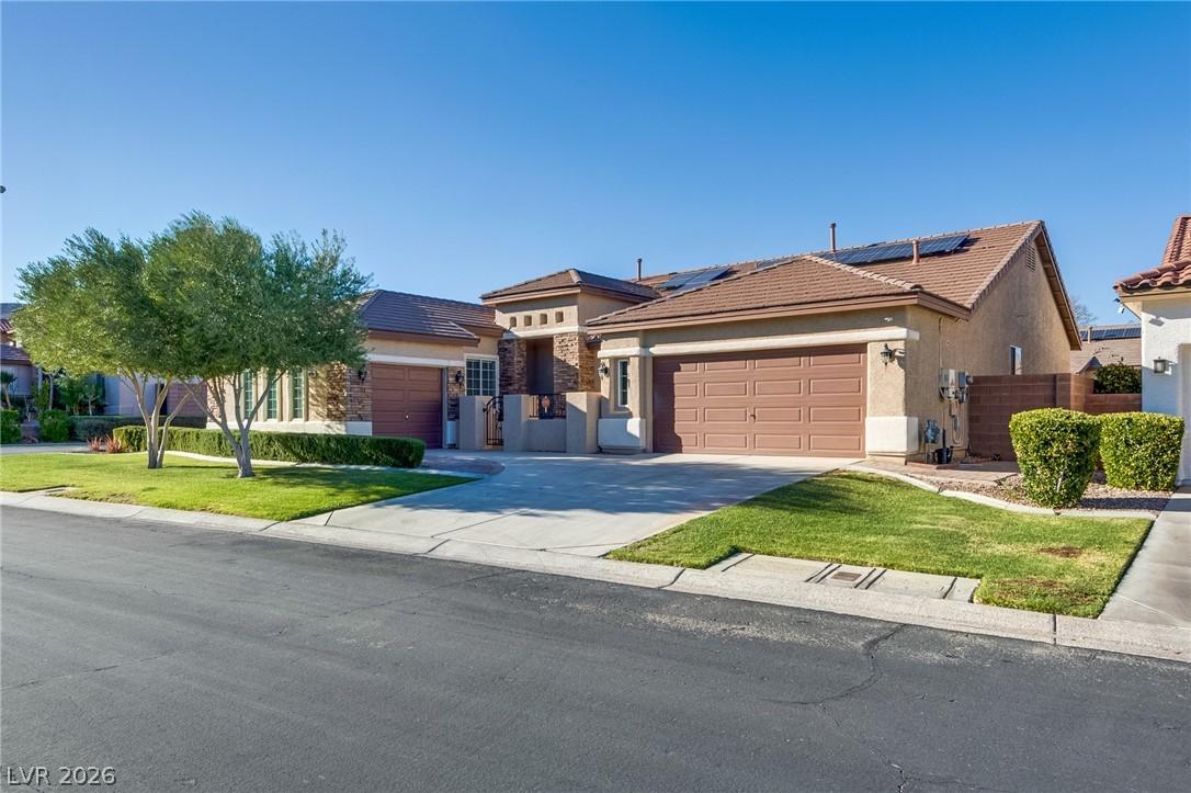 Image 4: Prairie-style home with stucco siding, a garage, c