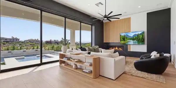 Image 2: Dramatic living room featuring soaring vaulted cei