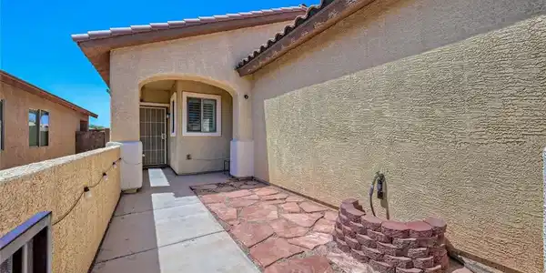 Image 3: An inviting entry to this home features a charming